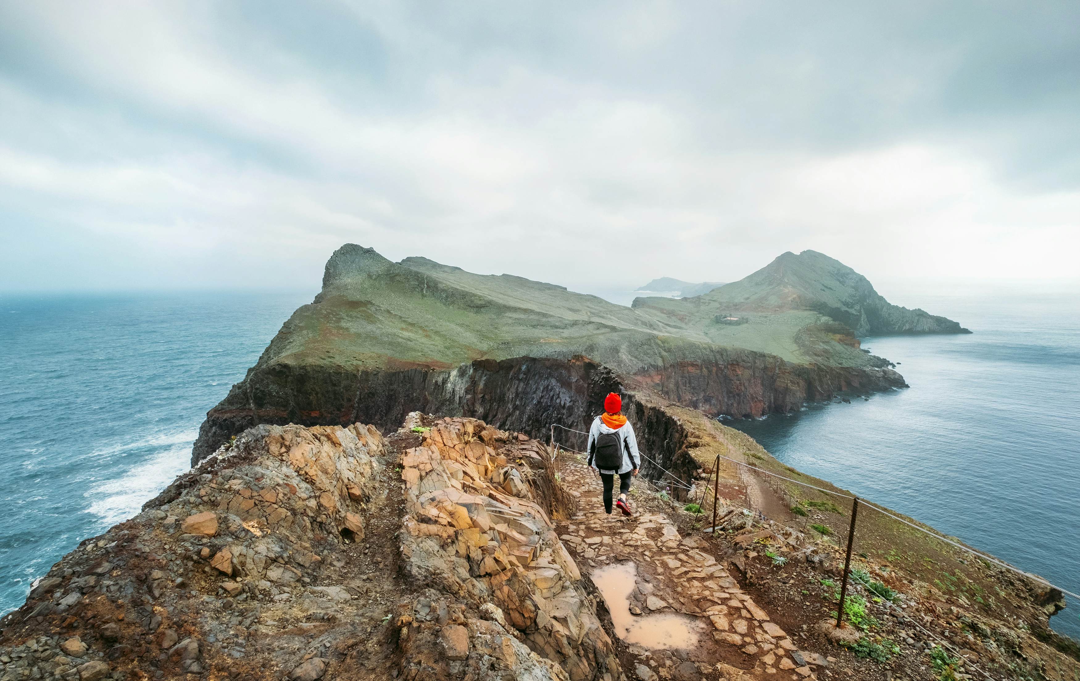A young woman explores the coastline of Madeira 